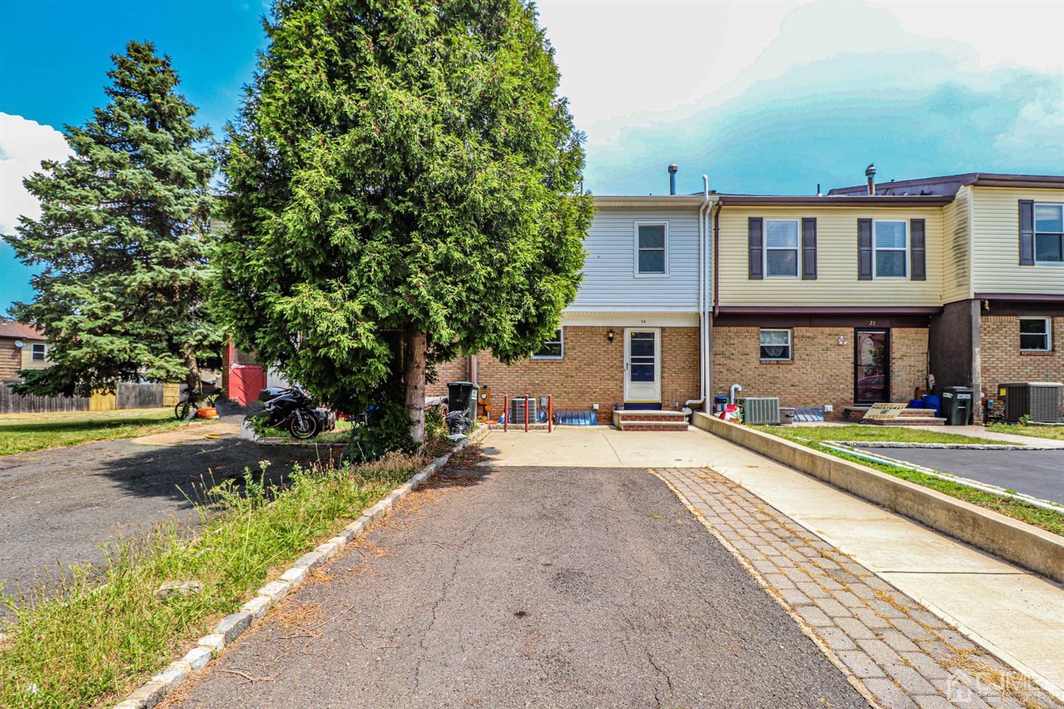 24 Redbud Road Piscataway, NJ 08854 - Photo 1 of 32 a front view of a house with a yard and potted plants