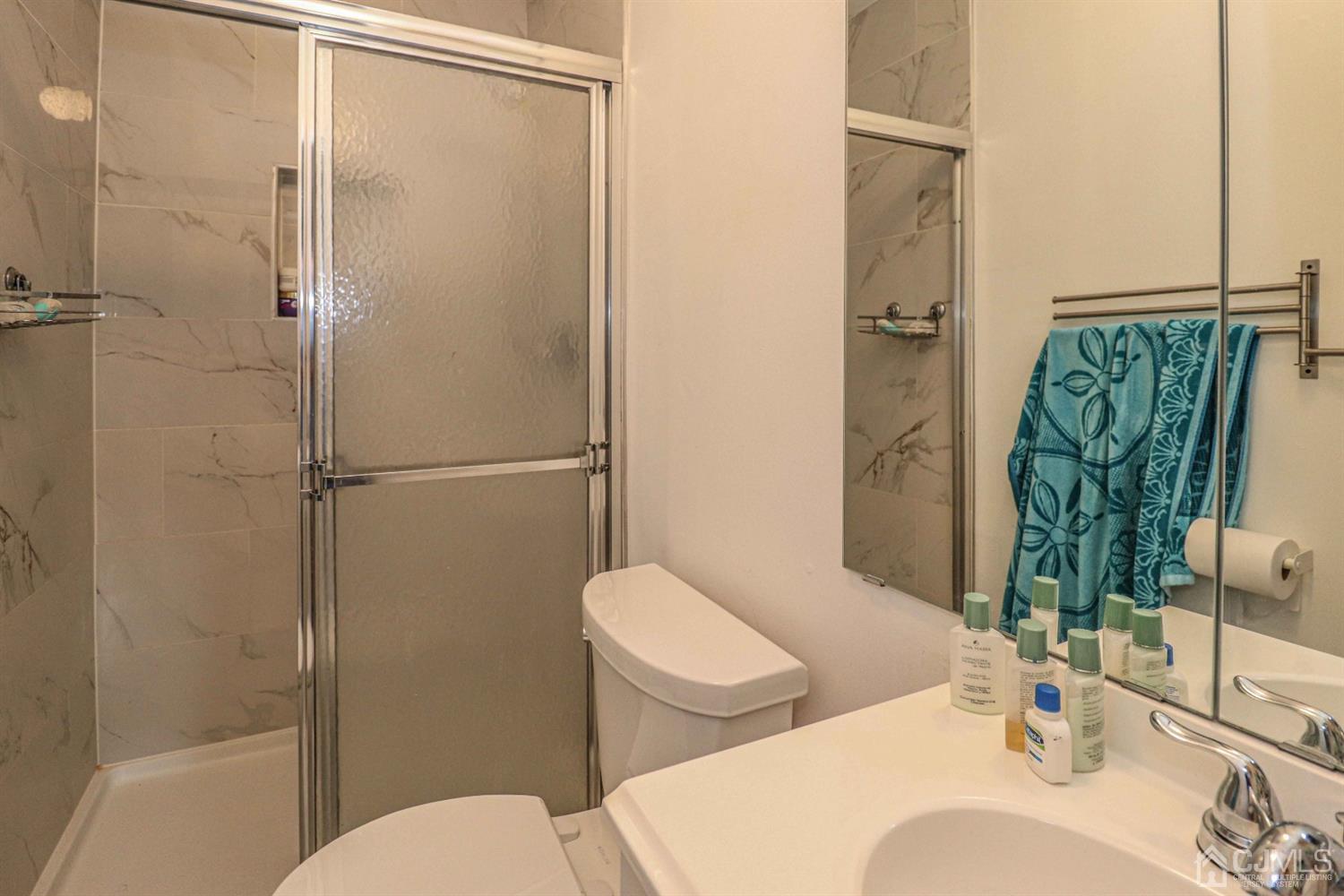 24 Redbud Road Piscataway, NJ 08854 - Photo 21 of 32 a bathroom with a toilet sink and shower