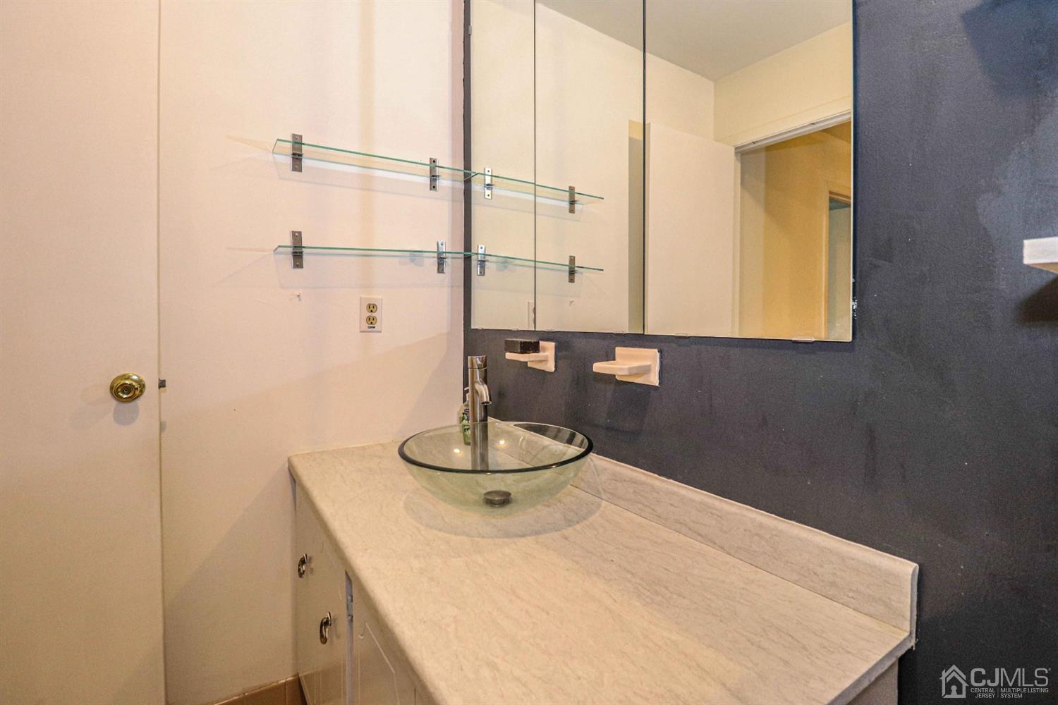 24 Redbud Road Piscataway, NJ 08854 - Photo 24 of 32 a bathroom with a sink and a mirror