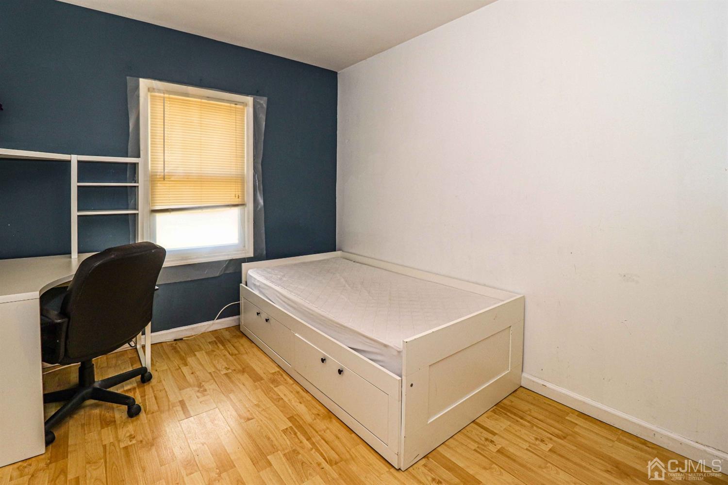 24 Redbud Road Piscataway, NJ 08854 - Photo 26 of 32 a bedroom with a bed and chair