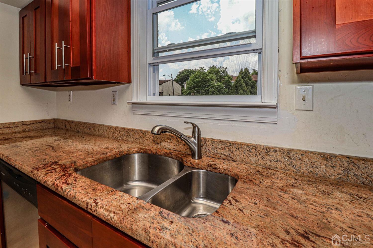 24 Redbud Road Piscataway, NJ 08854 - Photo 9 of 32 a kitchen with granite countertop a sink and window