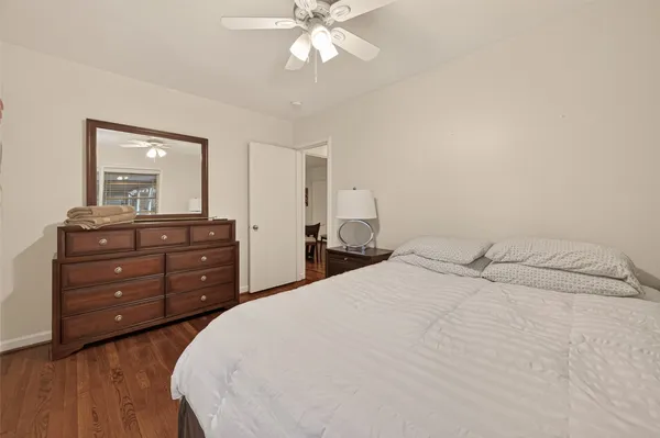 a bedroom with a bed and a dresser