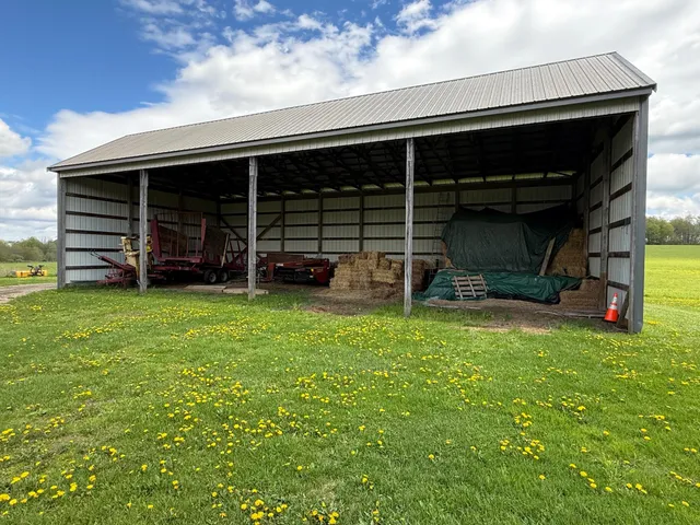 a white house with a large window and wooden floor