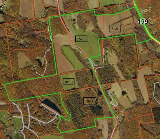 a view of a big yard with lots of green space