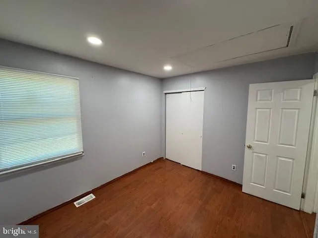 an empty room with a empty space and window