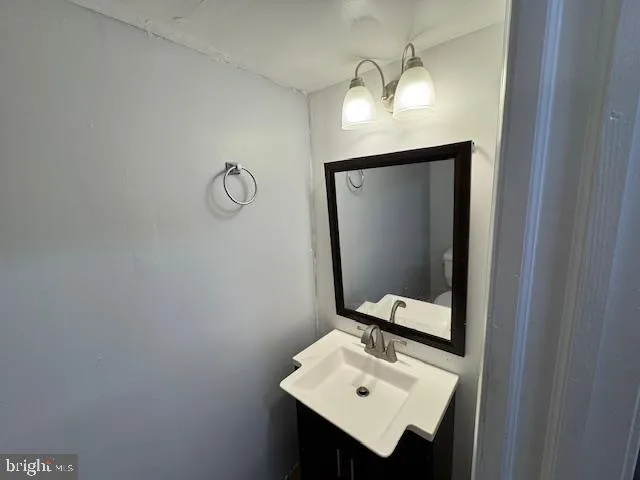 a bathroom with a sink and mirror
