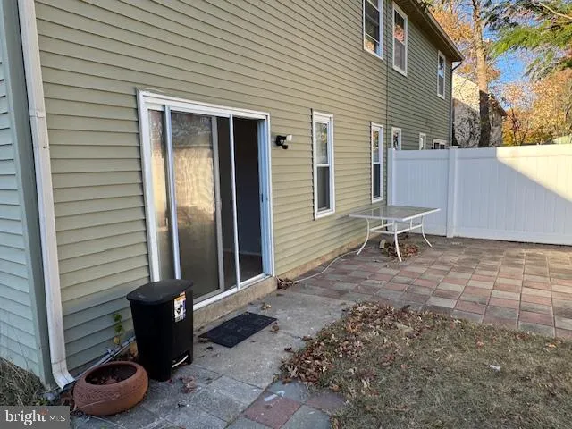 a view of a backyard with chair and tables
