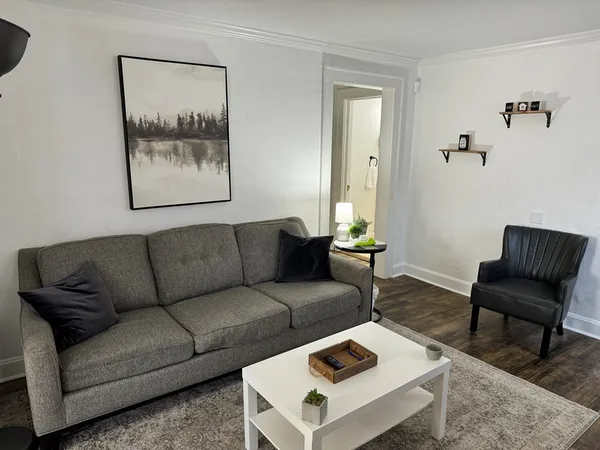 a view of a house with backyard and porch
