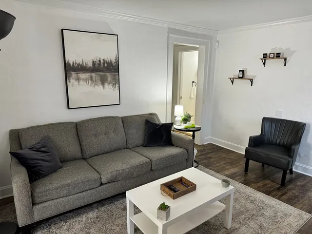 a view of a house with backyard and porch