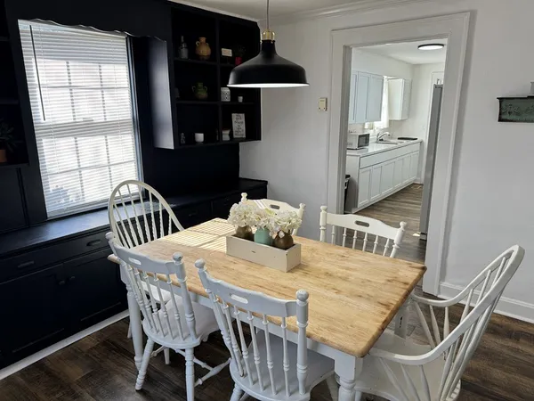 a view of a dining room with furniture and window