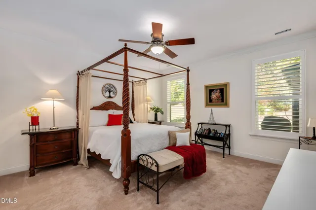 a bedroom with furniture and a window