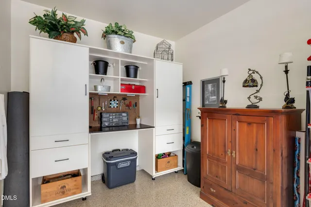 a view of a livingroom with furniture and a window