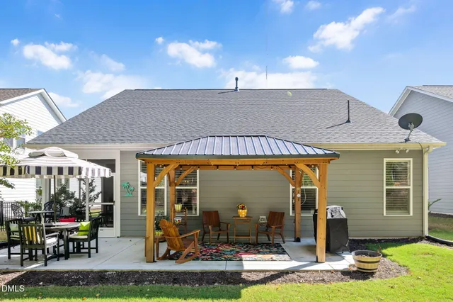 a patio with table and chairs