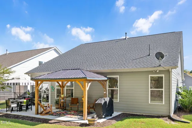 a aerial view of a house with a yard