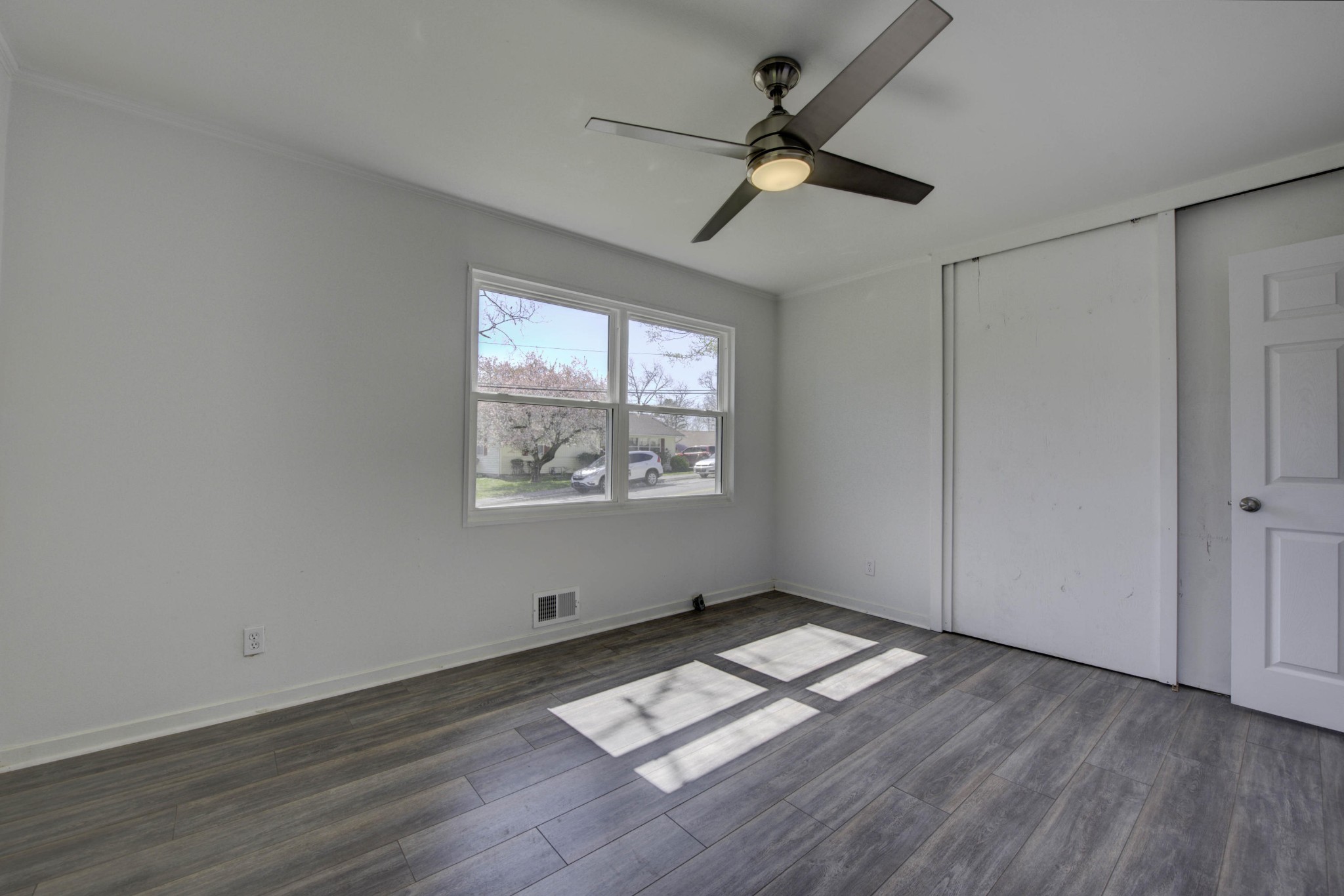 119 Alger Road Oak Ridge, TN 37830 - Photo 13 of 22 a view of empty room with wooden floor and fan