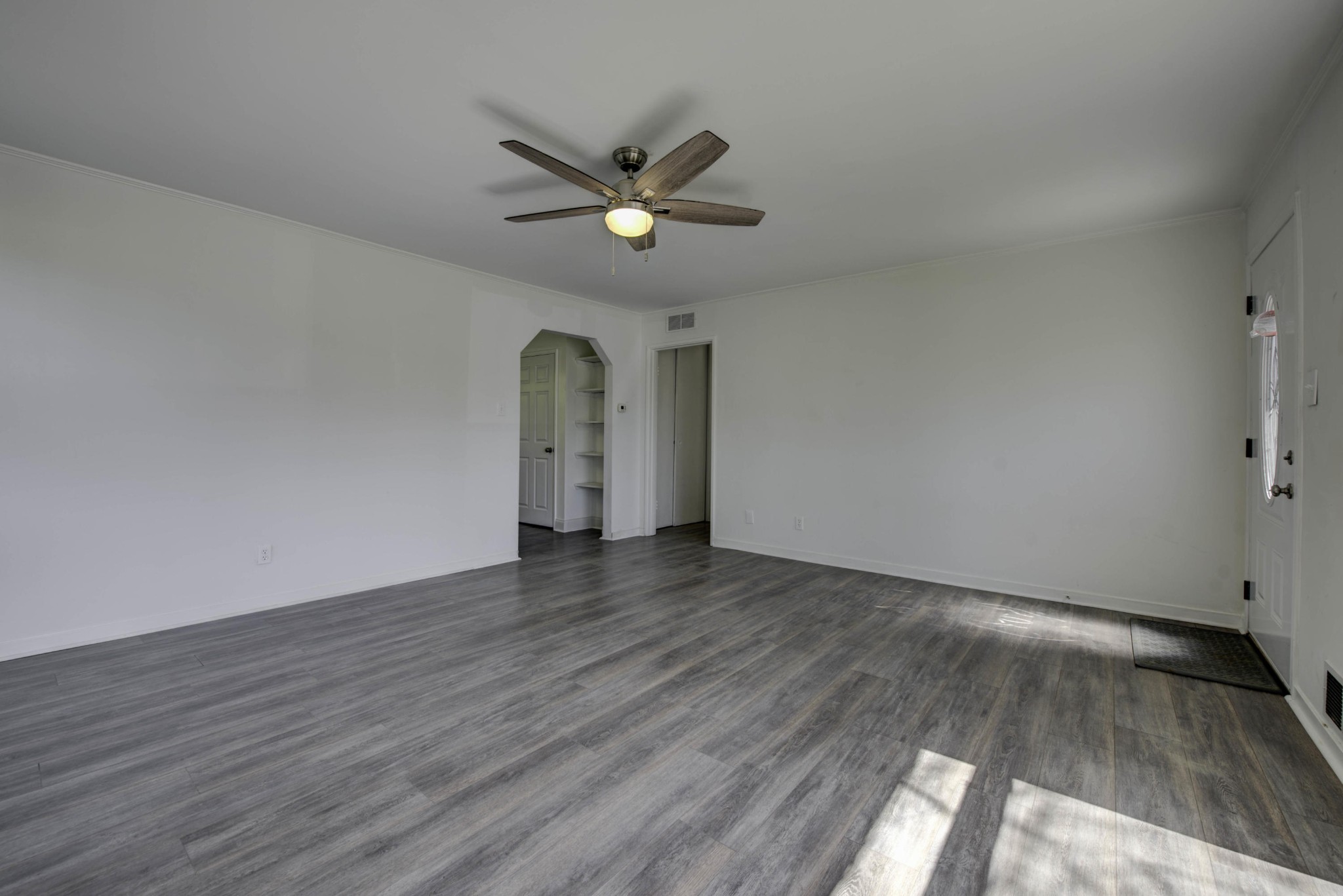 119 Alger Road Oak Ridge, TN 37830 - Photo 5 of 22 a view of an empty room with wooden floor and a window