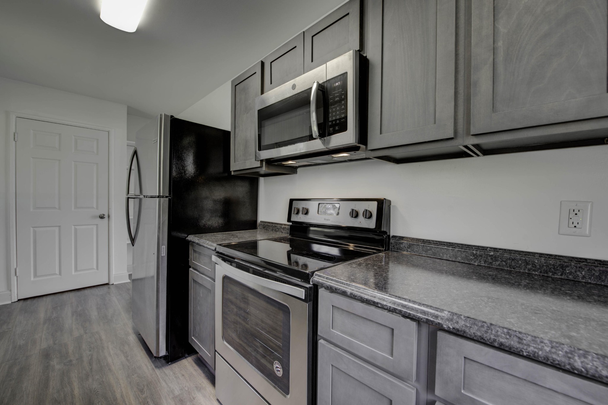 119 Alger Road Oak Ridge, TN 37830 - Photo 8 of 22 a kitchen with stainless steel appliances granite countertop a stove a microwave and a refrigerator