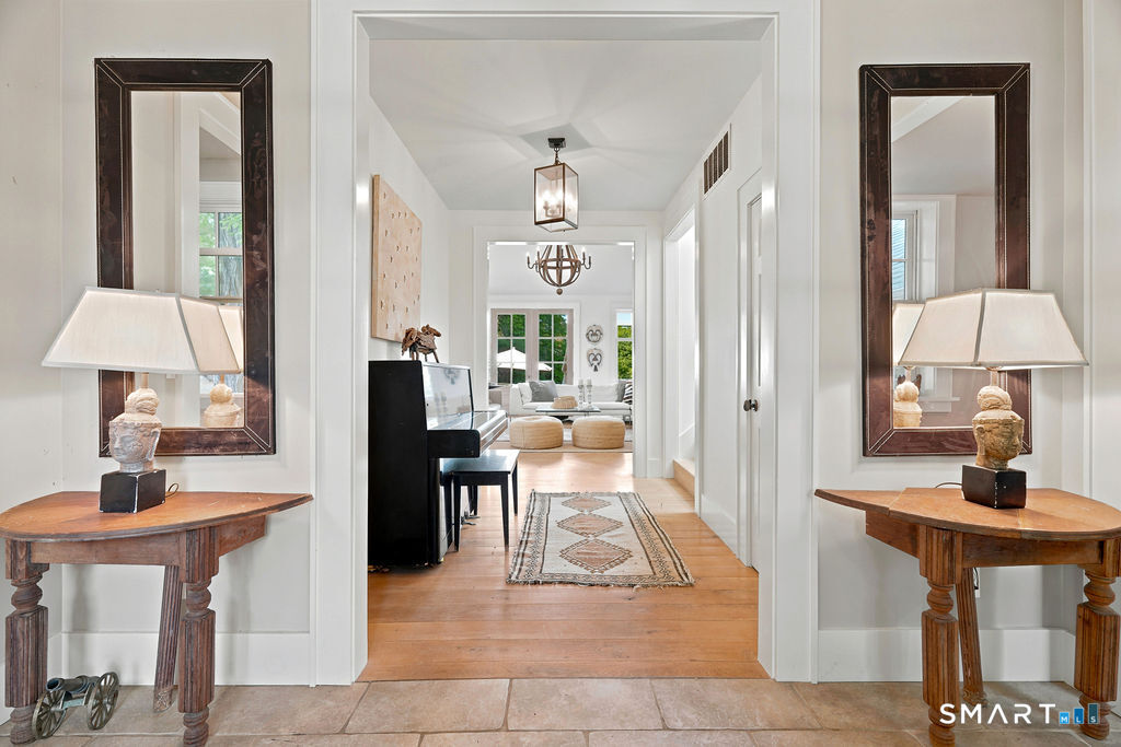 261-1 Grassy Hill Road Lyme, CT 06371 - Photo 5 of 40 The spacious foyer creates a gracious first impression, offering a warm and welcoming introduction to the home.
