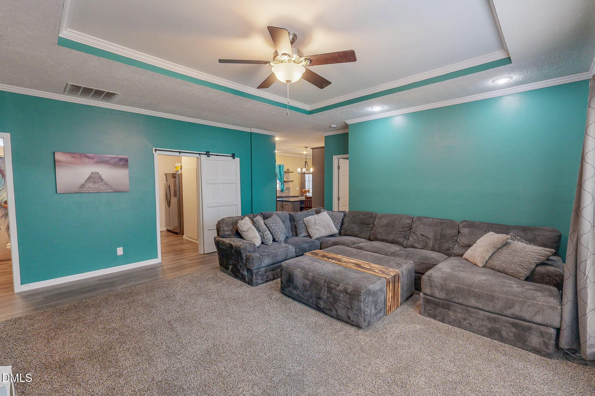 630 Clay Thomas Road Roxboro, NC 27573 - Photo 14 of 46 a living room with furniture and a ceiling fan