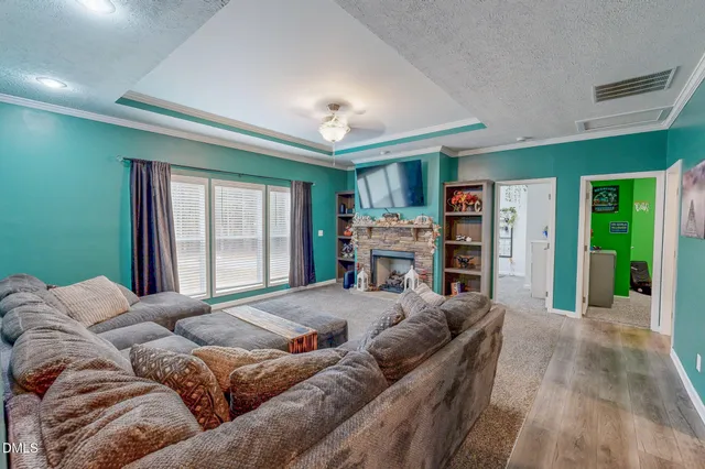 a kitchen with stainless steel appliances granite countertop furniture and a chandelier