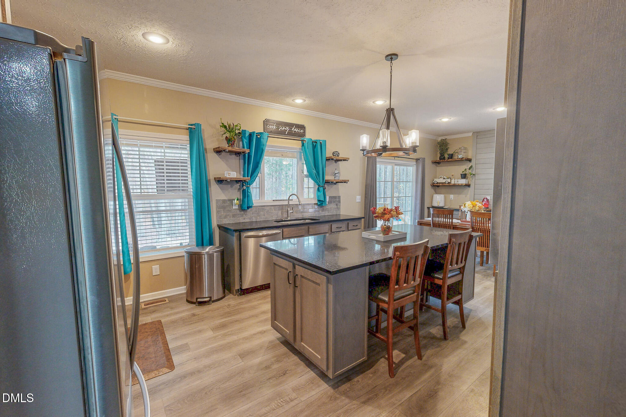 630 Clay Thomas Road Roxboro, NC 27573 - Photo 16 of 46 a kitchen with stainless steel appliances granite countertop furniture and a chandelier