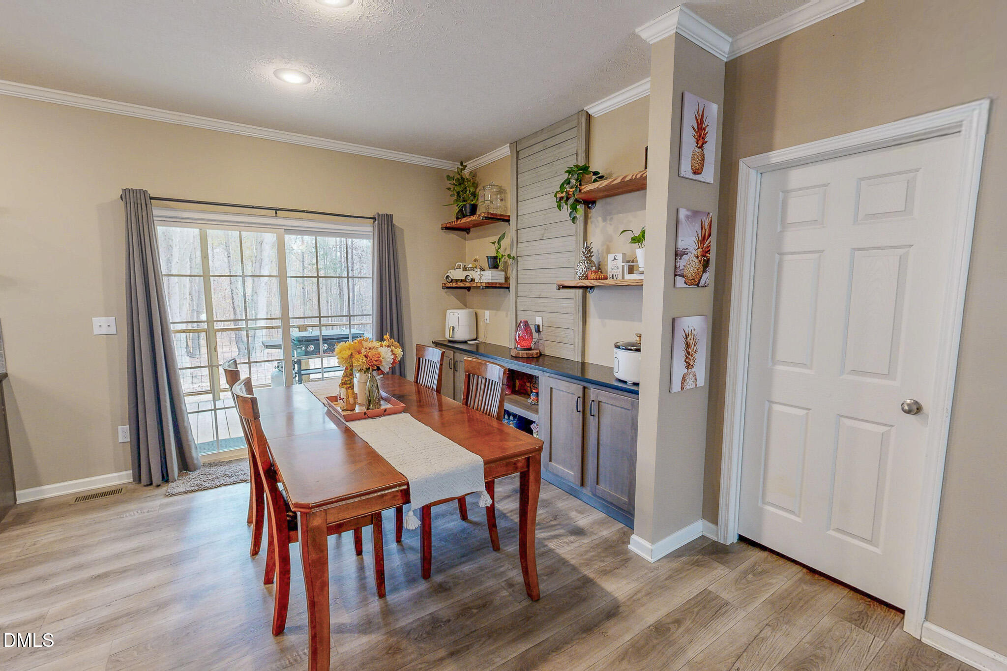 630 Clay Thomas Road Roxboro, NC 27573 - Photo 24 of 46 a view of a dining room with furniture and wooden floor