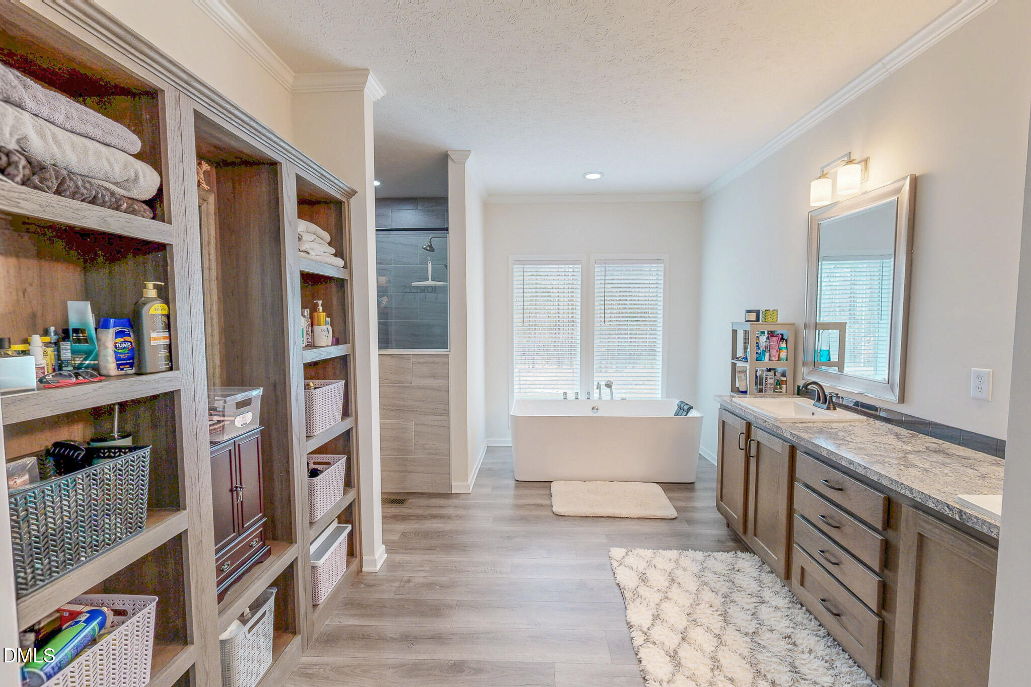 630 Clay Thomas Road Roxboro, NC 27573 - Photo 27 of 46 a spacious bedroom with a bed and a cabinets