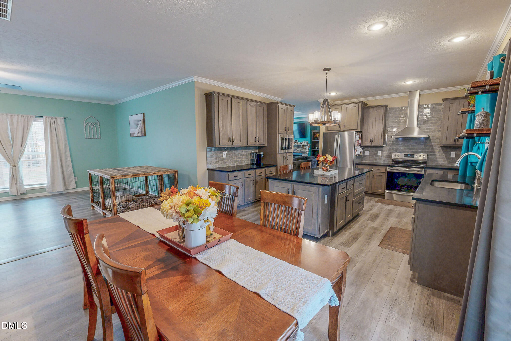 630 Clay Thomas Road Roxboro, NC 27573 - Photo 3 of 46 a view of a dining room with furniture