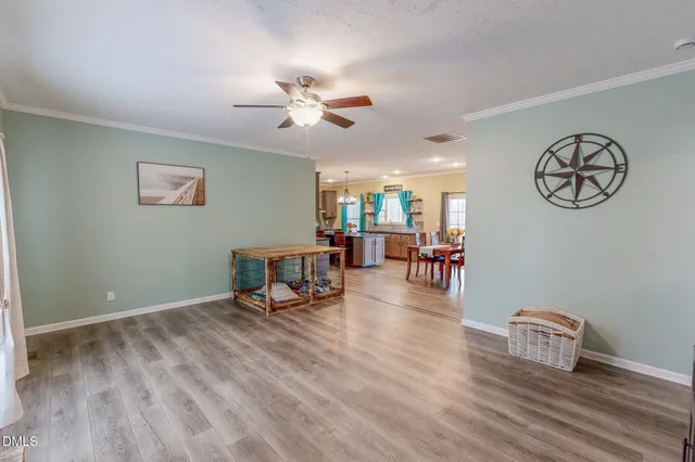 a view of a livingroom with furniture and a flat screen tv