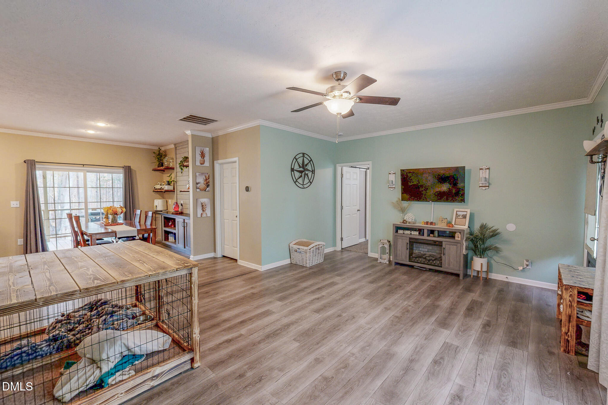 630 Clay Thomas Road Roxboro, NC 27573 - Photo 32 of 46 a view of a livingroom with furniture and a flat screen tv