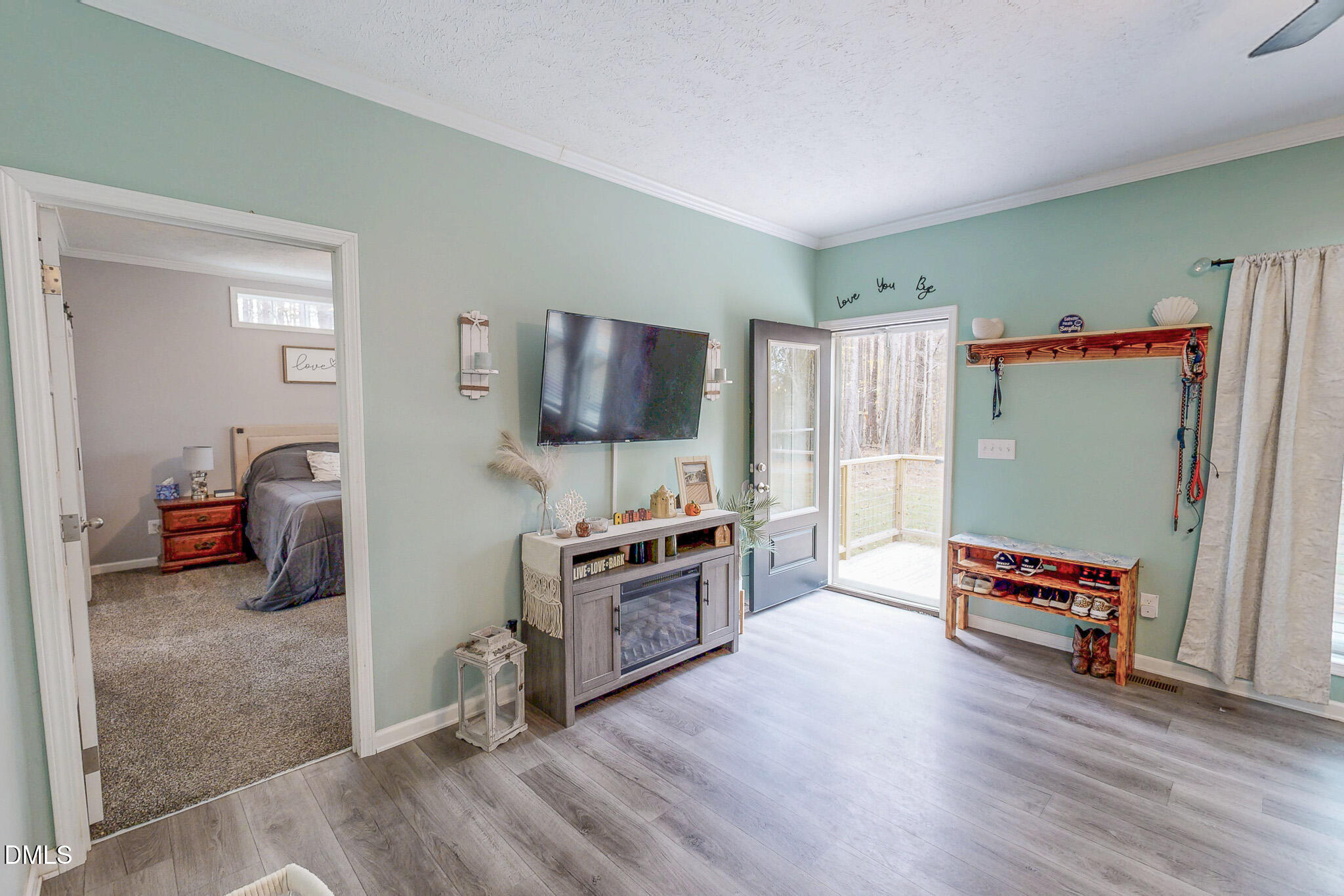 630 Clay Thomas Road Roxboro, NC 27573 - Photo 33 of 46 a view of a livingroom with furniture and an empty room
