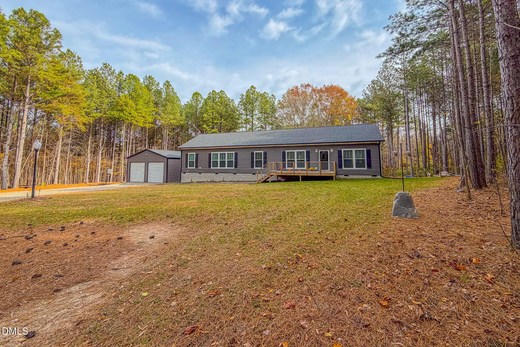 630 Clay Thomas Road Roxboro, NC 27573 - Photo 35 of 46 a view of swimming pool with outdoor seating and trees in the background
