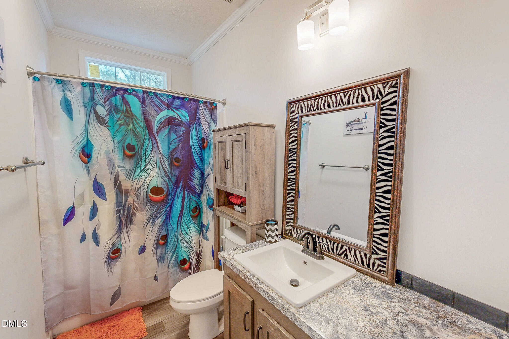 630 Clay Thomas Road Roxboro, NC 27573 - Photo 41 of 46 a bathroom with a sink toilet and shower