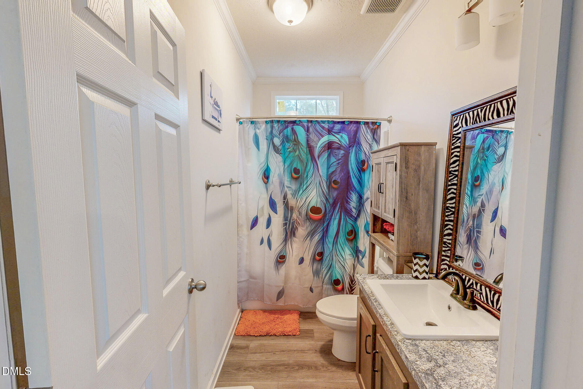 630 Clay Thomas Road Roxboro, NC 27573 - Photo 42 of 46 a bathroom with a sink toilet and shower