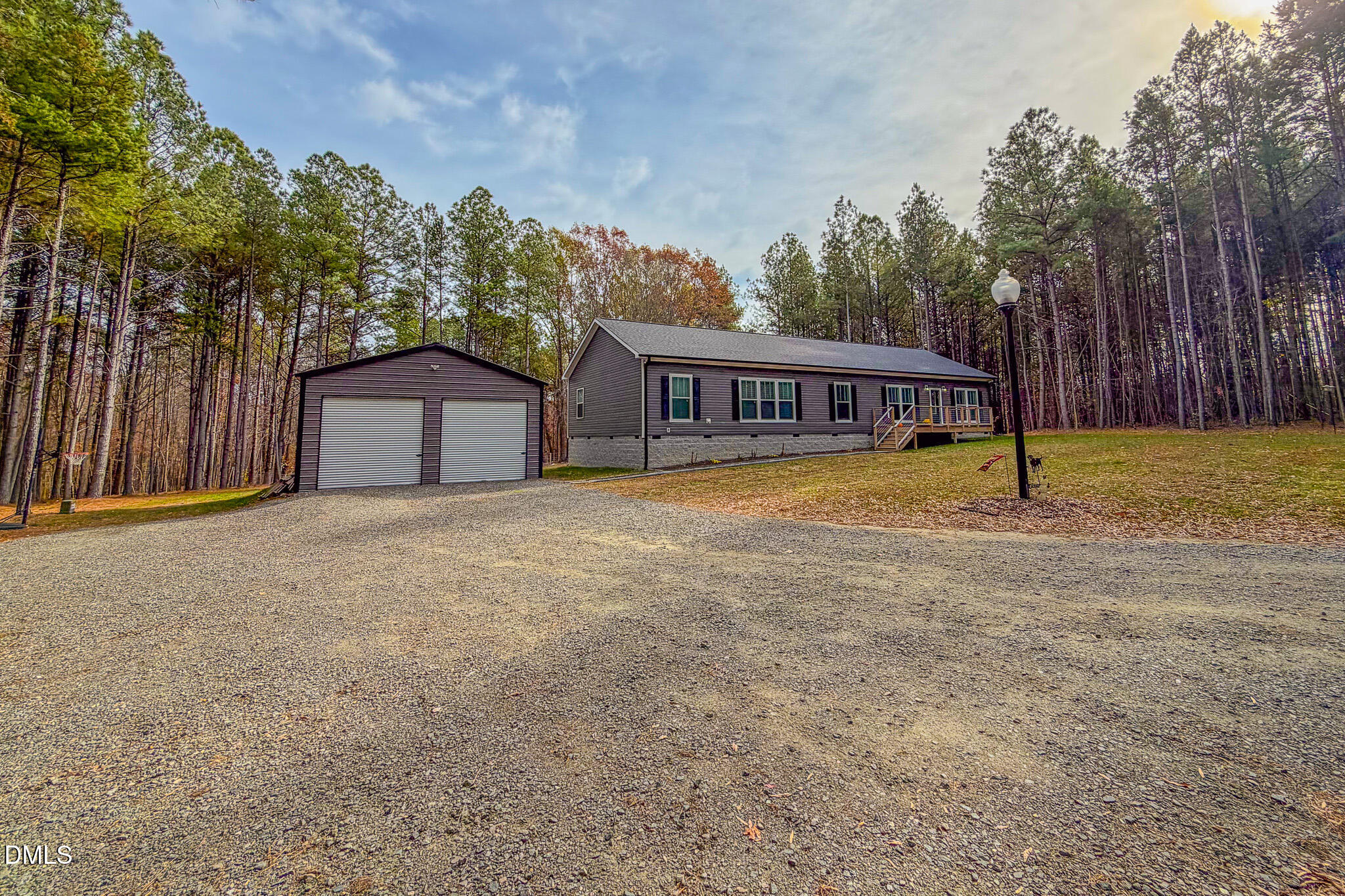 630 Clay Thomas Road Roxboro, NC 27573 - Photo 44 of 46 a view of a house with a yard and wooden fence