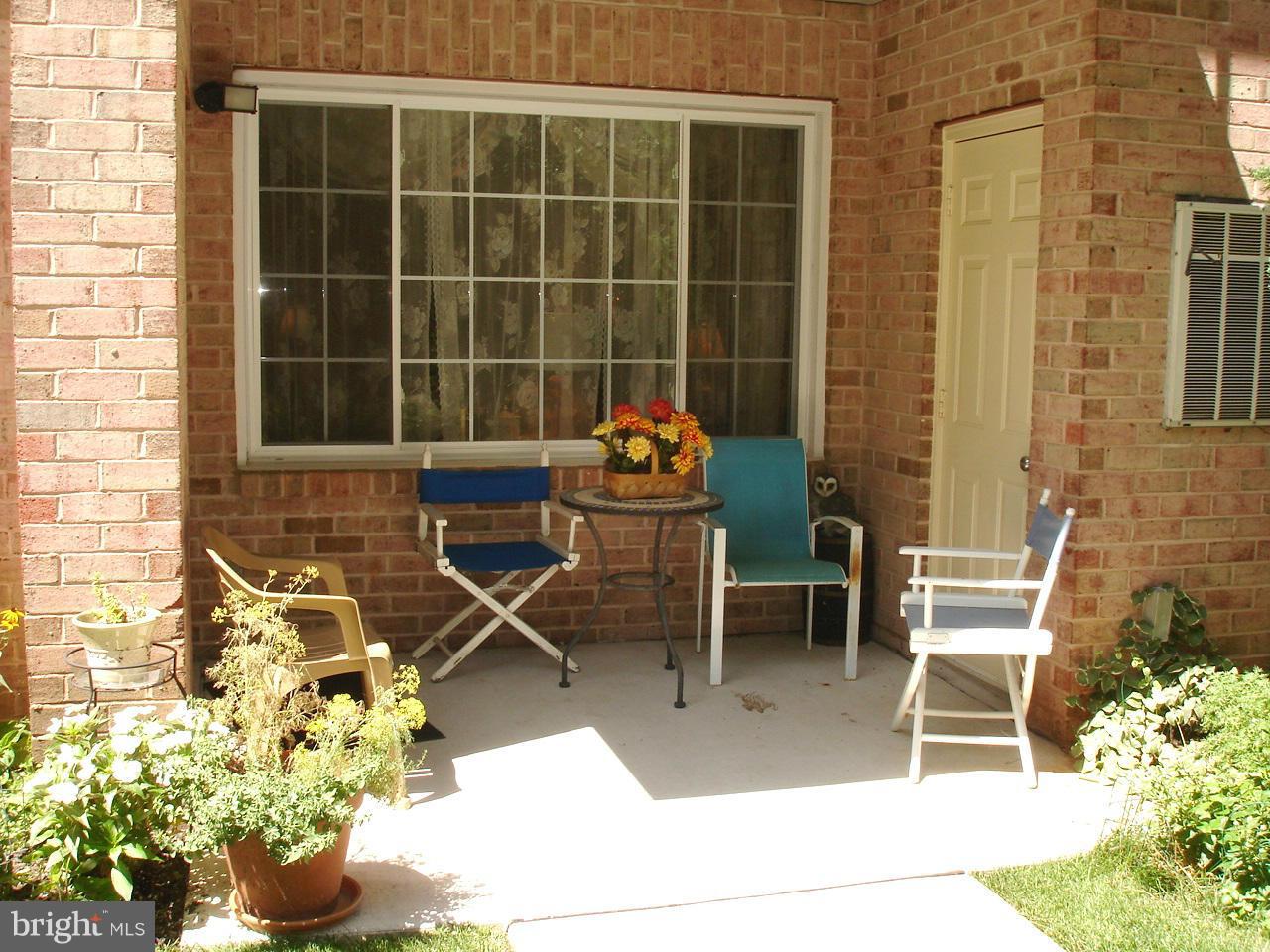 413 Rockfleet Road, Unit 101 Lutherville-Timonium, MD 21093 - Photo 23 of 27 LOVELY PATIO SETTING ON BACK SIDE OF BUILDING