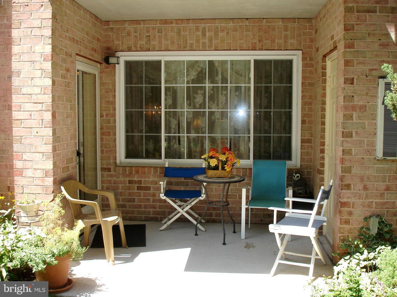 413 Rockfleet Road, Unit 101 Lutherville-Timonium, MD 21093 - Photo 24 of 27 LOVELY PATIO SETTING ON BACK SIDE OF BUILDING