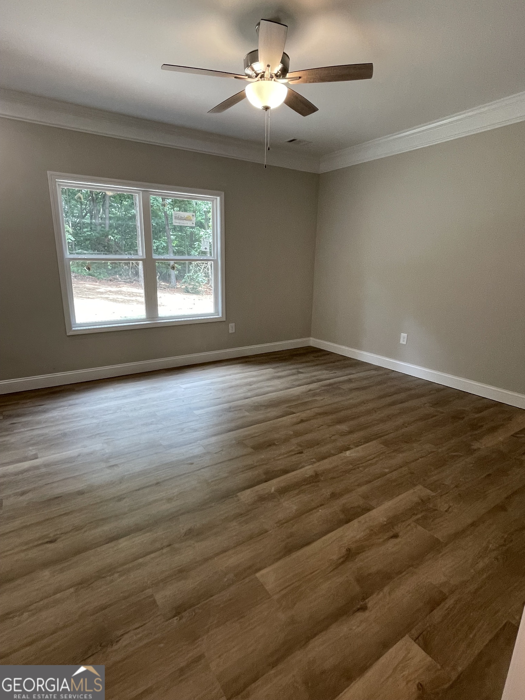 115 Drues Road Bowdon, GA 30108 - Photo 5 of 13 wooden floor in an empty room with a window