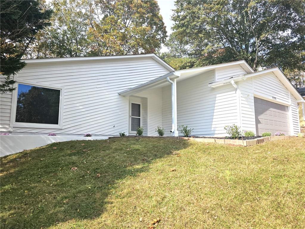10085 Old Woodland Entry Johns Creek, GA 30022 - Photo 1 of 34 a backyard of a house