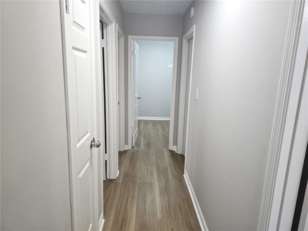 10085 Old Woodland Entry Johns Creek, GA 30022 - Photo 17 of 34 a view of a bathroom from a hallway