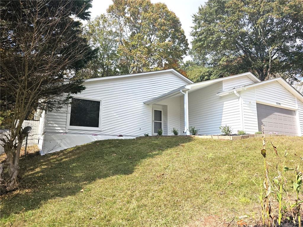 10085 Old Woodland Entry Johns Creek, GA 30022 - Photo 2 of 34 a view of a backyard with large trees