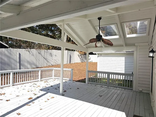 a view of a balcony with wooden floor