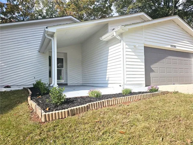 a front view of a house with a garage