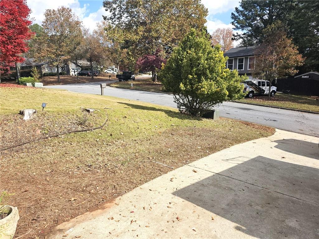 10085 Old Woodland Entry Johns Creek, GA 30022 - Photo 4 of 34 a view of yard with swimming pool