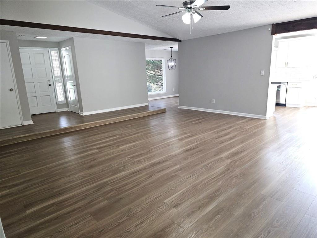 10085 Old Woodland Entry Johns Creek, GA 30022 - Photo 7 of 34 an empty room with wooden floor and window