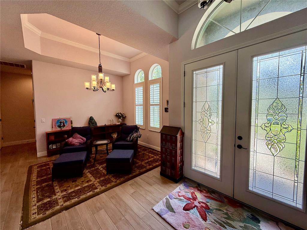 13110 Bamboo Street Spring Hill, FL 34609 - Photo 39 of 56 a living room with furniture and wooden floor