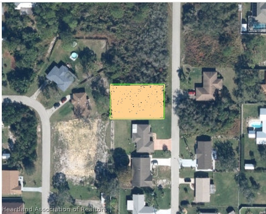 1603 Falcon Avenue Sebring, FL 33872 - Photo 2 of 6 an aerial view of residential houses with outdoor space and parking
