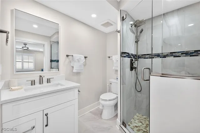 a bedroom with two beds and a chandelier