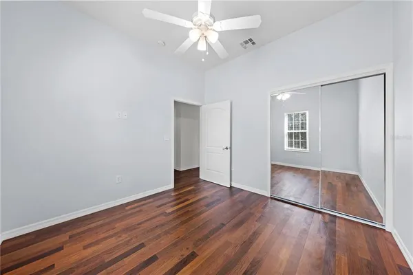 a front view of a house with a garden and yard