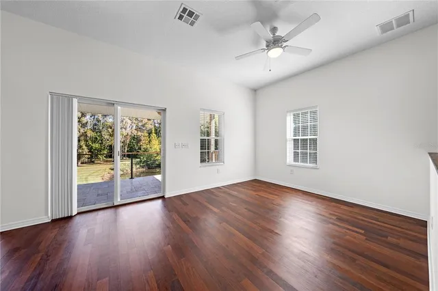 a open kitchen with a sink stove and wooden floor